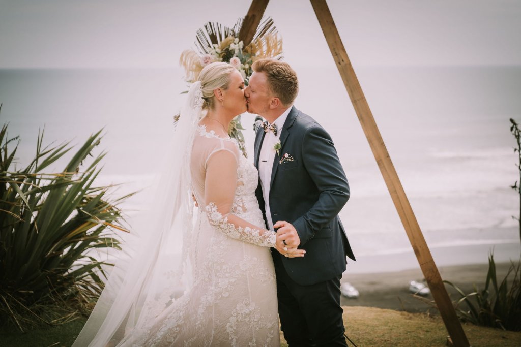 Real Bride Jamielle wearing her Custom Harriett Falvey Wedding Dress and Veil Made in New Zealand